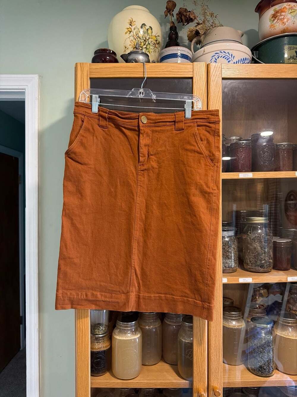 The Main Street Exchange Keisha Knee Length Stretch Denim Skirt in Deep Rust Siz
